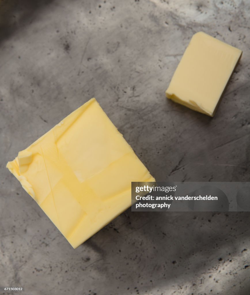 Butter on pewter plate.