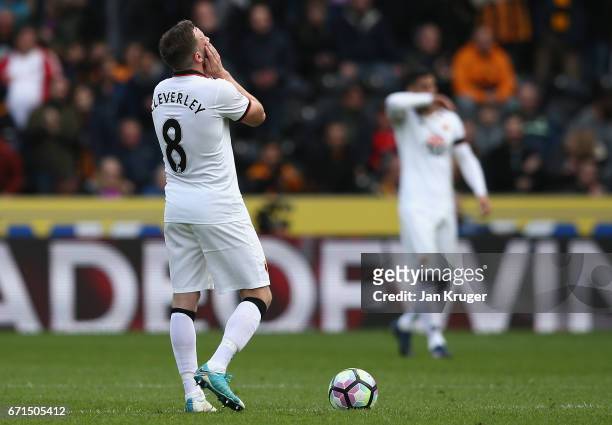 Tom Cleverley of Watford looks dejected during the Premier League match between Hull City and Watford at the KCOM Stadium on April 22, 2017 in Hull,...