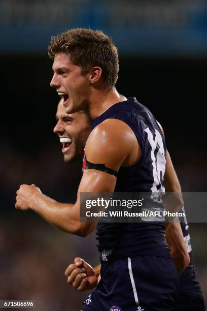 Darcy Tucker and Lachie Weller of the Dockers celebrates after defeating the Kangaroos during the round five AFL match between the Fremantle Dockers...