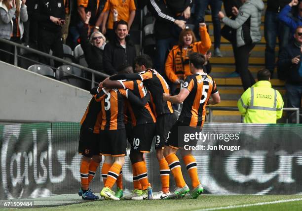 Sam Clucas of Hull City celebrates with team mates after scoring his sides second goal during the Premier League match between Hull City and Watford...