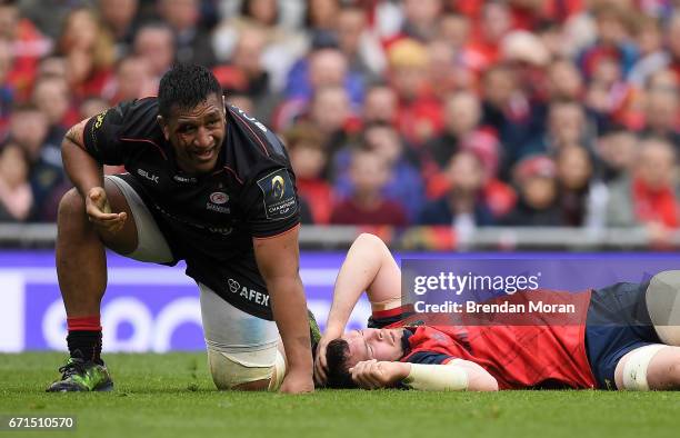 Dublin , Ireland - 22 April 2017; Peter OMahony of Munster lies injured after a clash with Mako Vunipola of Saracens, left, during the European Rugby...