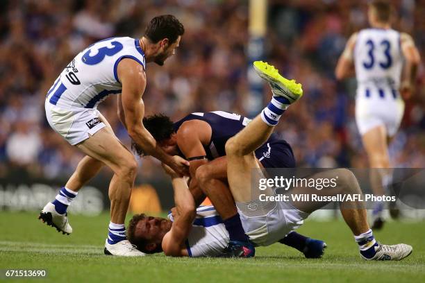 Brady Grey of the Dockers wrestles with Lachlan Hansen of the Kangaroos during the round five AFL match between the Fremantle Dockers and the North...