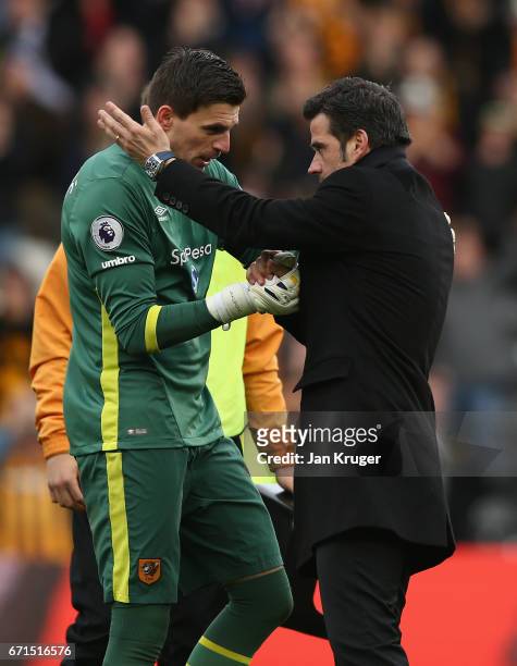 Eldin Jakupovic of Hull City and Marco Silva, Manager of Hull City speak following victory during the Premier League match between Hull City and...