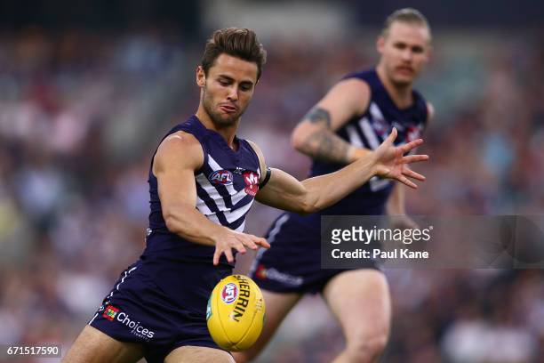 Lachie Weller of the Dockers passes the ball during the round five AFL match between the Fremantle Dockers and the North Melbourne Kangaroos at...