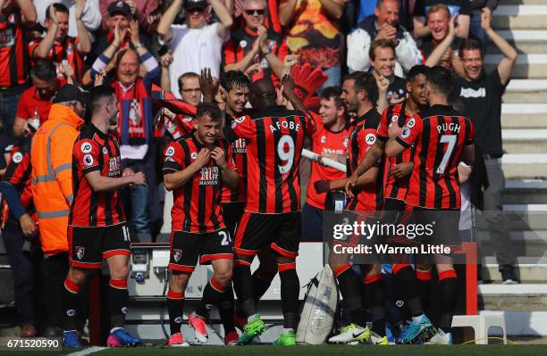 Charlie Daniels of AFC Bournemouth celebrates scoring his sides fourth goal with team mates during the Premier League match between AFC Bournemouth...