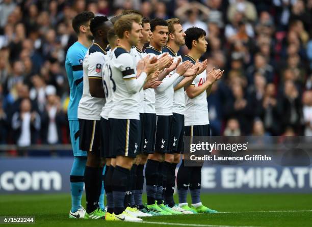 Tottenham Hotspur players stand during the minutes appluse for Ugo Ehiogu prior to The Emirates FA Cup Semi-Final between Chelsea and Tottenham...