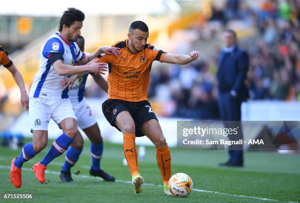 Jason Lowe of Blackburn Rovers and Romain Saiss of Wolverhampton Wanderers during the Sky Bet Championship match between Wolverhampton Wanderers and...