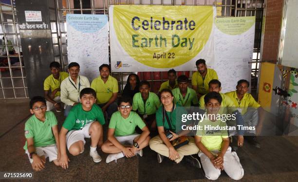 School children and Safai Sena members educating the public on the International Earth Day at the New Delhi Railway Station, on April 22, 2017 in New...