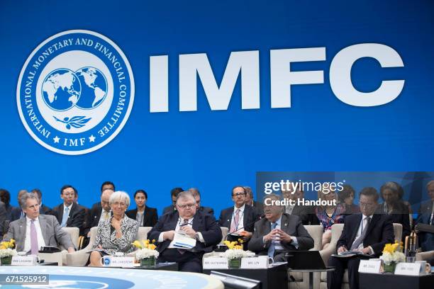 In this handout provided by the IMF, International Monetary Fund Managing Director Christine Lagarde speaks as IMF Deputy MD David Lipton , Chairman...