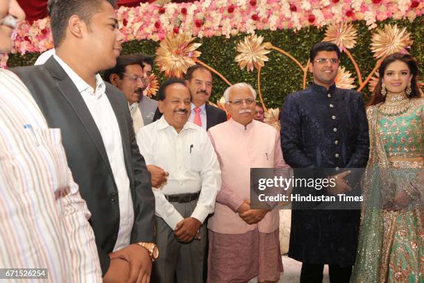 Haryana Chief Minister Manohar Lal Khattar, Union Minister Harsh Vardhan with INLD MP Dushyant Chautala and Meghna Ahlawat during their wedding...