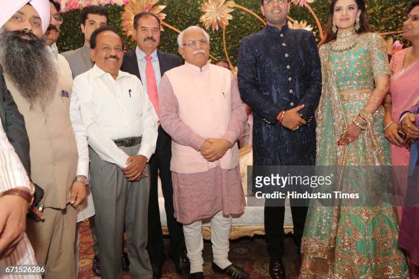 Haryana Chief Minister Manohar Lal Khattar, Union minister Harsh Vardhan with INLD MP Dushyant Chautala and Meghna Ahlawat during their wedding...