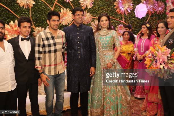 Boxer Vijender Singh with INLD MP Dushyant Chautala and Meghna Ahlawat during their wedding reception at Ashoka Hotel, on April 20, 2017 in New...