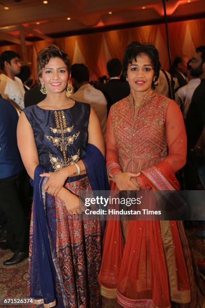 Freestyle wrestlers Geeta and Babita Phogat during the wedding reception of INLD MP Dushyant Chautala with Meghna Ahlawat at Ashoka Hotel, on April...