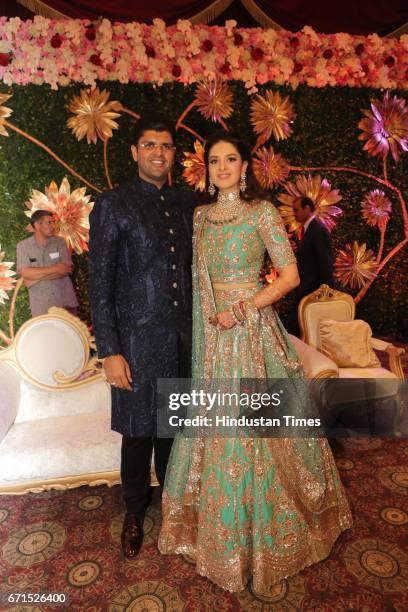 Dushyant Chautala with Meghna Ahlawat during their wedding reception at Ashoka Hotel, on April 20, 2017 in New Delhi, India. Dushyant Chautala is the...