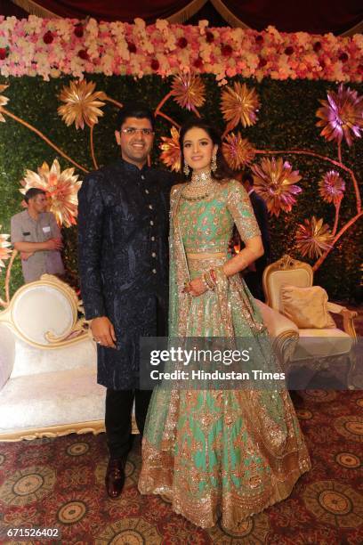 Dushyant Chautala with Meghna Ahlawat during their wedding reception at Ashoka Hotel, on April 20, 2017 in New Delhi, India. Dushyant Chautala is the...