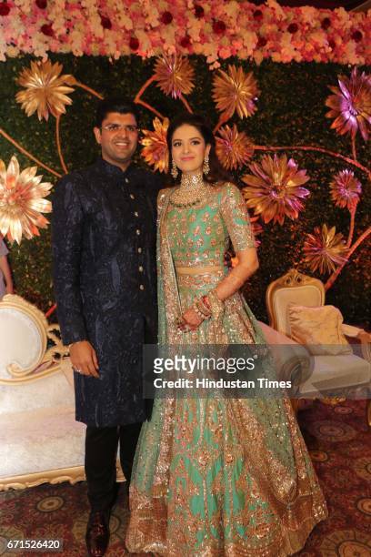 Dushyant Chautala with Meghna Ahlawat during their wedding reception at Ashoka Hotel, on April 20, 2017 in New Delhi, India. Dushyant Chautala is the...