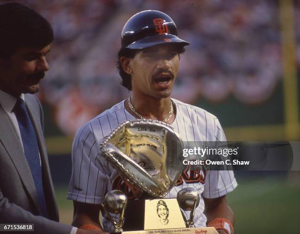 Benito Santiago of the San Diego Padres circa 1988 receives his gold glove award at Jack Murphy Stadium in San Diego, California.