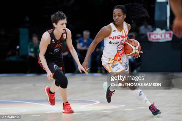 Charlevilles' Victoria Majekodumni of France runs with the ball during the women's French basketball cup ProA final match Bourges vs...