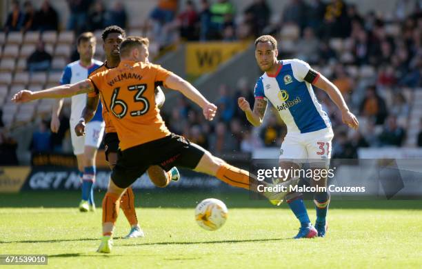 Elliot Bennett of Blackburn Rovers passes he ball ahead of Andreas Weimann of Wolverhampton Wanderers during the Sky Bet Championship match between...