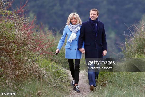 Head of the political movement En Marche! and candidate for the 2017 presidential election, Emmanuel Macron and his wife Brigitte Trogneux pose for a...