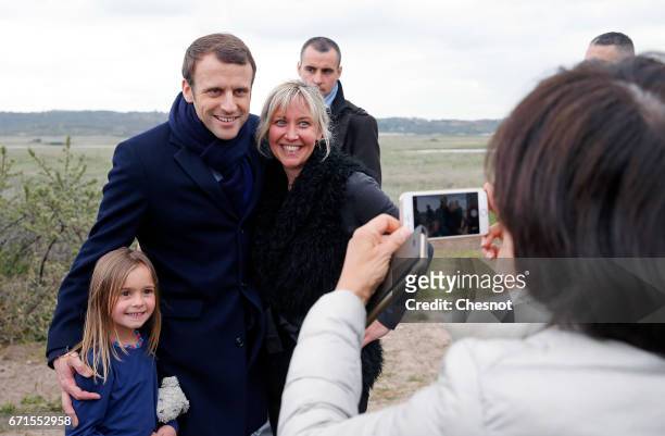 Emmanuel Macron, head of the political movement En Marche! and candidate for the 2017 presidential election poses with residents of Le Touquet on...