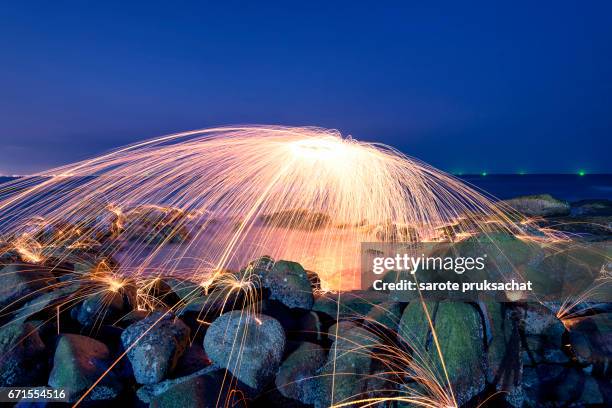 amazing fire steel wool photography. - burning steel wool firework stock pictures, royalty-free photos & images