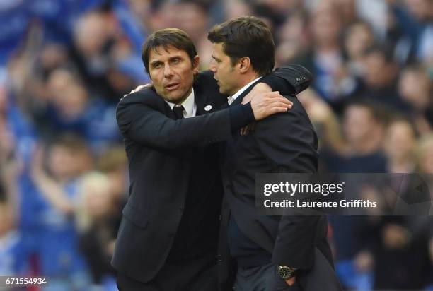 Antonio Conte, Manager of Chelsea and Mauricio Pochettino, Manager of Tottenham Hotspur shake hands after the full time whistle during The Emirates...