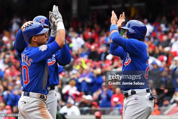 Willson Contreras of the Chicago Cubs celebrates with Addison Russell of the Chicago Cubs after hitting a grand-slam home run in the second inning...