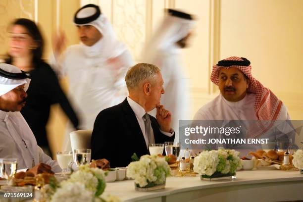 Qatar Minister of State for Defense Affairs Khalid bin Mohammed al-Attiyah sits with US Defence Secretary James Mattis for dinner at his residence in...