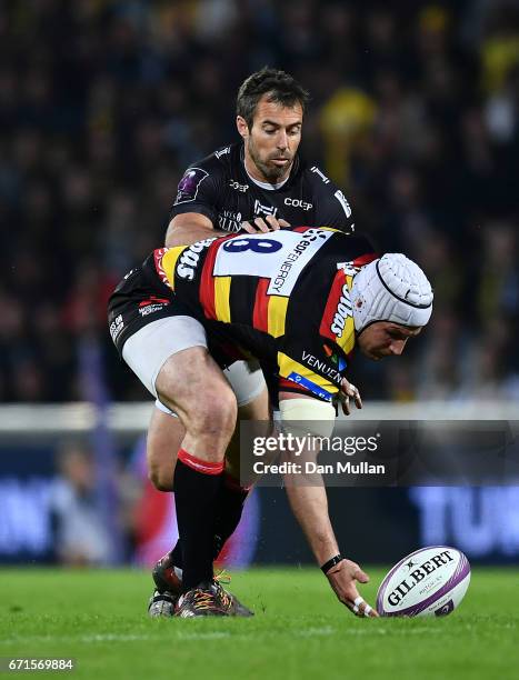 Ben Morgan of Gloucester gathers the loose ball under pressure from Brock James of La Rochelle during the European Rugby Challenge Cup Semi Final...