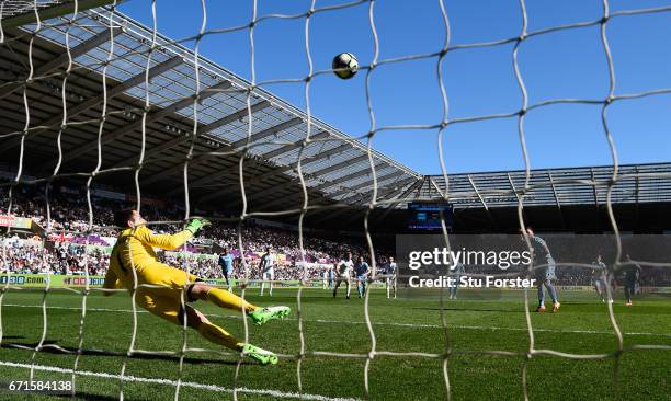 Swansea goalkeeper Lukasz Fabianski looks on as Stoke player Marko Arnautovic puts his penalty over the bar during the Premier League match between...