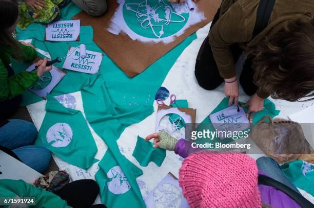 Demonstrators make signs and banners during the March for Science rally on Earth Day in New York, U.S., on Saturday, April 22, 2017. The March for...