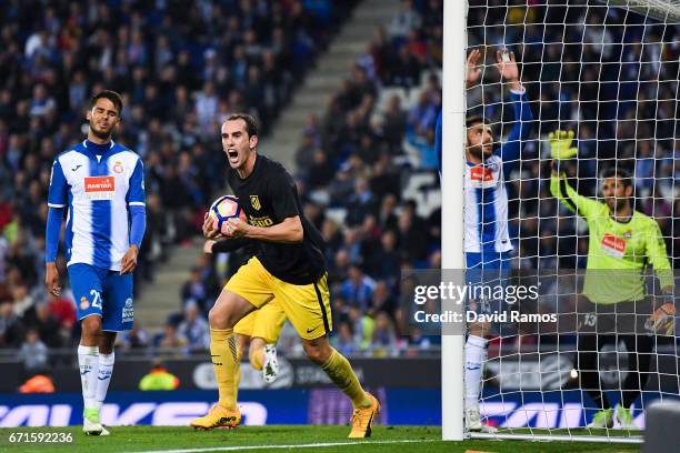 Diego Godin of Club Atletico de Madrid celebrates after his team mate Antoine Griezmann of Club Atletico de Madrid scored the opening goal during the...