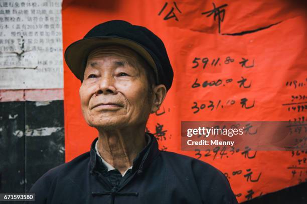 confident chinese senior man chengyang china real people portrait - tribal head gear in china stock pictures, royalty-free photos & images