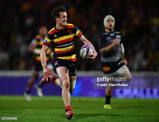 Billy Burns of Gloucester breaks away to score his side's first try during the European Rugby Challenge Cup Semi Final match between La Rochelle and...