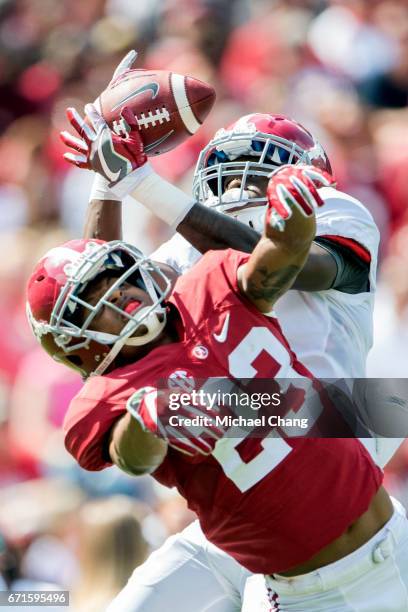 Wide receiver Jerry Jeudy of the Alabama Crimson Tide catches a pass in over defensive back Aaron Robinson of the Alabama Crimson Tide at...