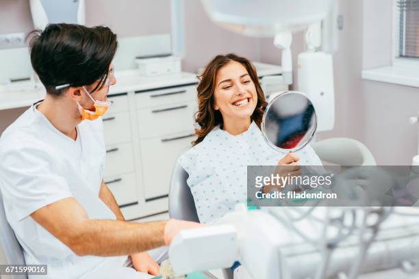 at the dentist's - mid adult men stock pictures, royalty-free photos & images