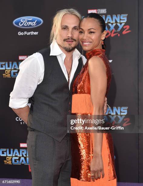 Artist Marco Perego and actress Zoe Saldana arrive at the premiere of Disney and Marvel's 'Guardians of the Galaxy Vol. 2' at Dolby Theatre on April...