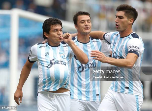 Luis Rodriguez of Atletico de Tucuman celebrates with teammates after scoring the penalty goal for his team during a match between Racing and...