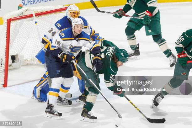 Jay Bouwmeester and goalie Jake Allen of the St. Louis Blues defend their goal against Ryan White of the Minnesota Wild in Game Five of the Western...