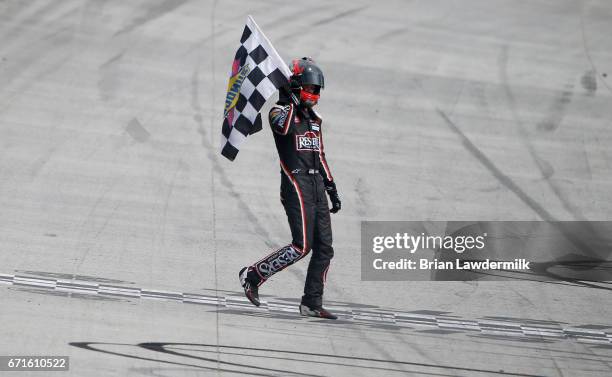 Erik Jones, driver of the Reser's American Classic Toyota, celebrates with the checkered flag after winning the NASCAR XFINITY Series Fitzgerald...