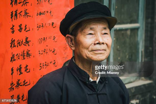 chinese senior man chengyang china real people portrait - tribal head gear in china stock pictures, royalty-free photos & images