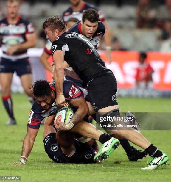 Philip van der Walt and Stephan Lewies of the Cell C Sharks tackling Amanaki Mafi of the Melbourne Rebels during the Super Rugby match between Cell C...