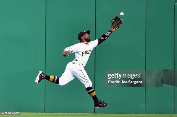 Andrew McCutchen of the Pittsburgh Pirates can't make a catch on a ball hit by Aaron Judge of the New York Yankees during the sixth inning at PNC...