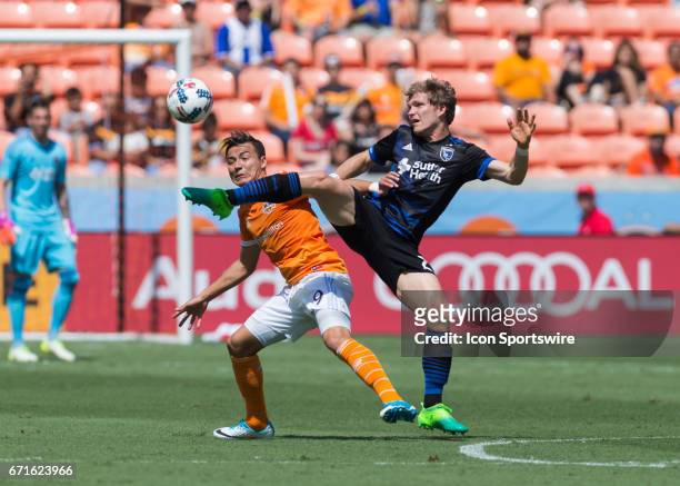 San Jose Earthquakes midfielder Florian Jungwirth stretches to keep the ball away from Houston Dynamo forward Erick Torres during the MLS match...