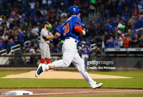 Michael Conforto of the New York Mets runs the bases after his first inning home run against Tanner Roark of the Washington Nationals at Citi Field...