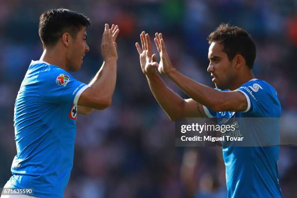 Francisco Silva of Cruz Azul celebrates with teammate Adrian Aldrete after scoring his team's first goal during the 15th round match between Cruz...