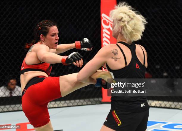 Alexis Davis of the Canada kicks Cindy Dandois of Belgium in their women's bantamweight bout during the UFC Fight Night event at Bridgestone Arena on...