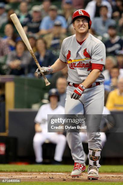 Jedd Gyorko of the St. Louis Cardinals reacts after being hit by a pitch in the first inning against the Milwaukee Brewers at Miller Park on April...