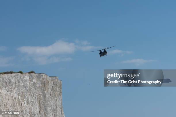 helicopter flying over beachy head - chinook dog stock pictures, royalty-free photos & images